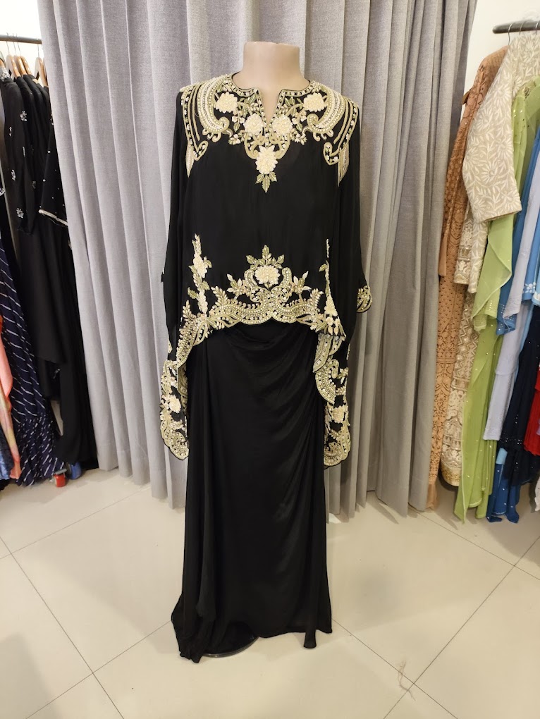 Black embroidered cape and skirt with gold threadwork